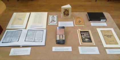 A table with various books and leaflets displayed on it that relate to the Holodomor.